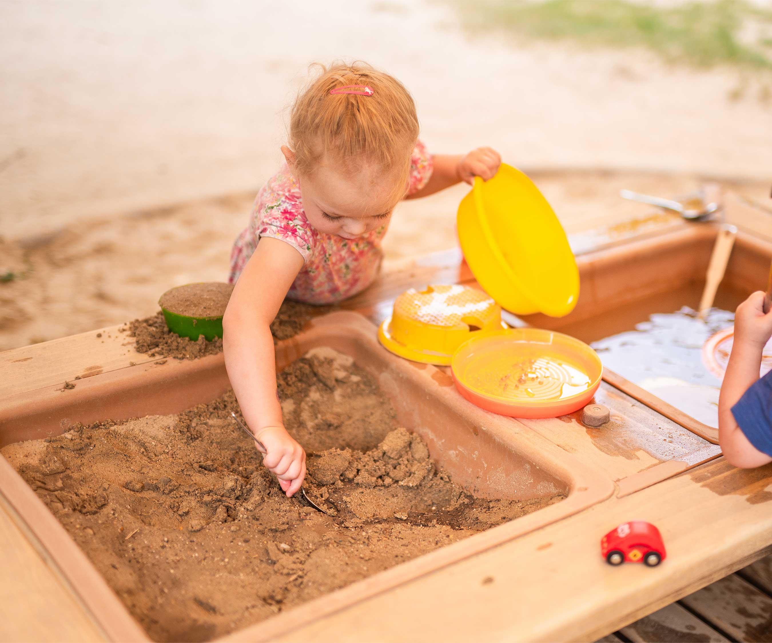 Girl at water table