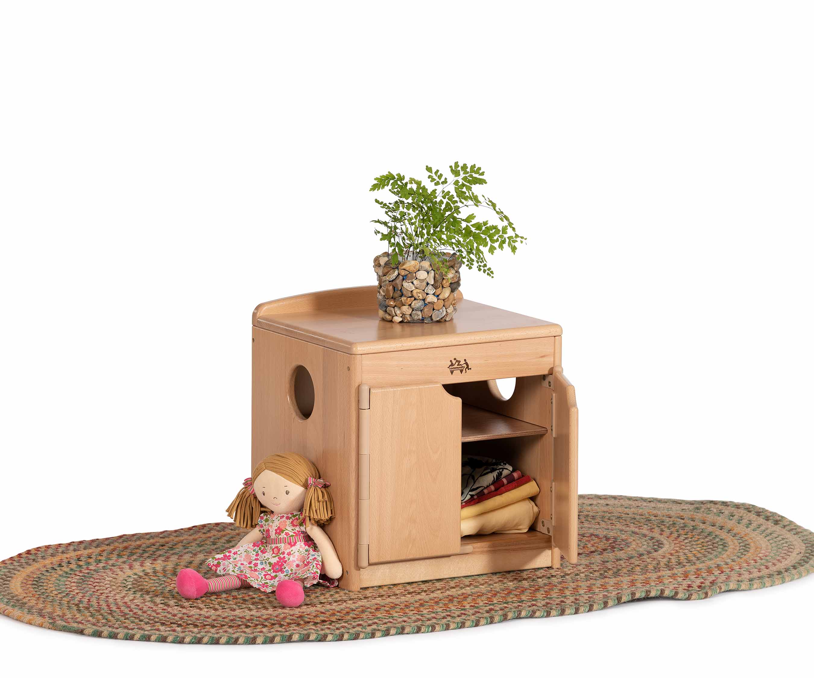 Low cabinet with toys and rug